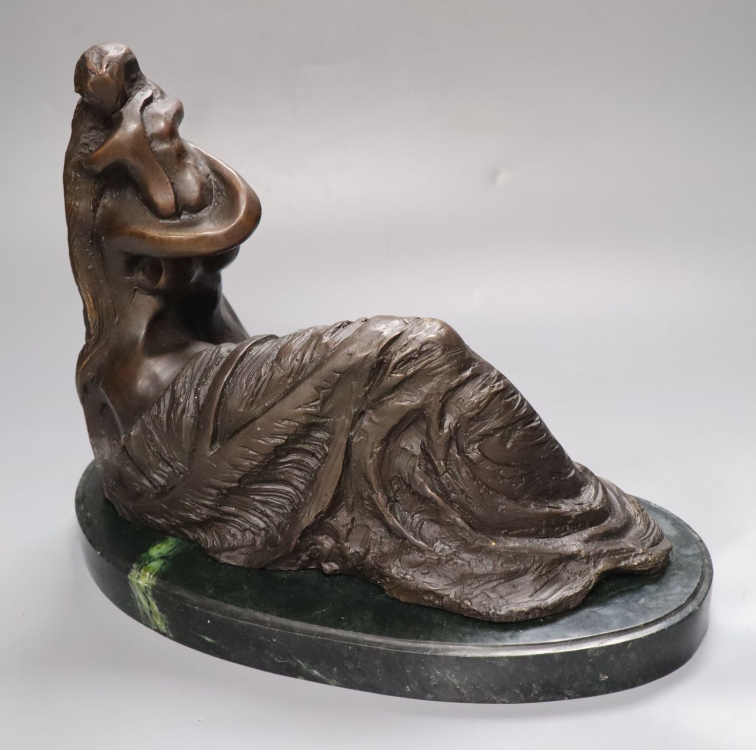 An abstract bronze of a mother and child, on marble base, indistinctly signed, height 26cm